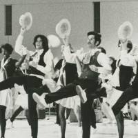 Students dancing on a stage.
